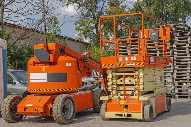 warehouse worker operating forklift to stack inventory in Centerville MN